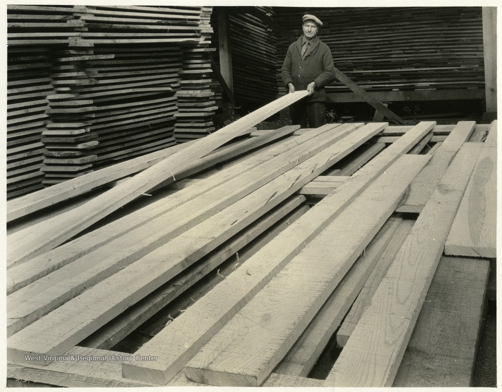 Lumber Yard Employee with Stacked Wood West Virginia History OnView WVU Libraries