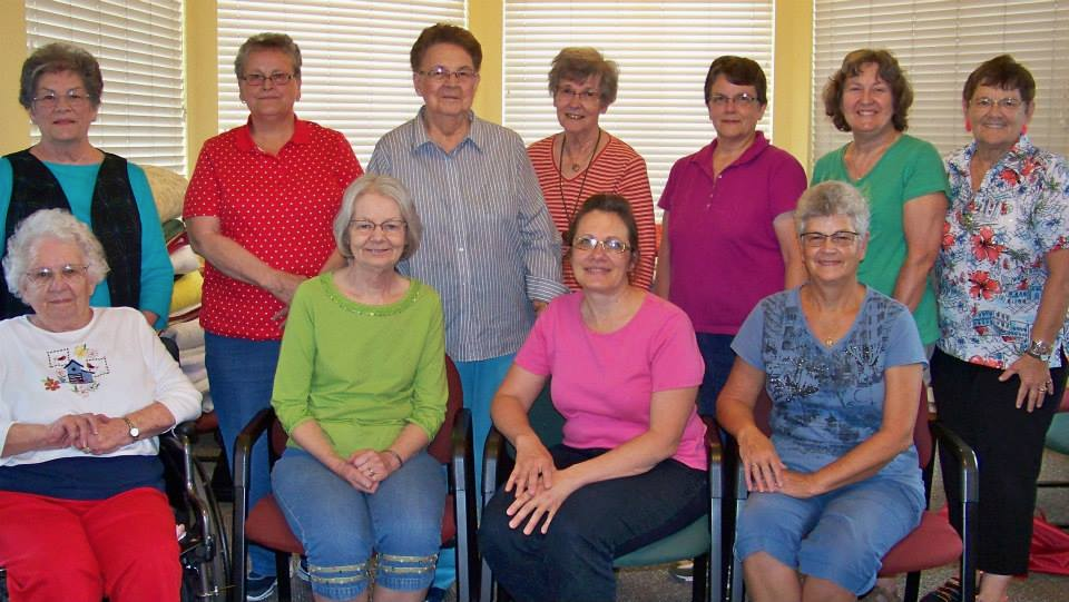 HELPING HANDS Quilt Group presented a quilt show to the residents of