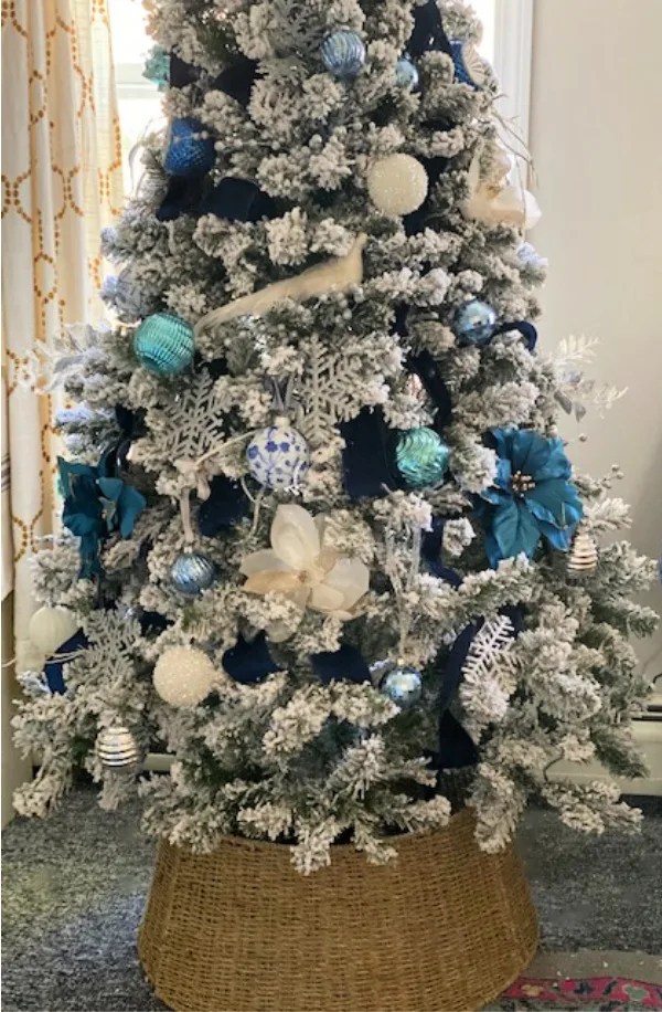 Elegant Flocked Christmas Tree With Blue And Silver Decorations