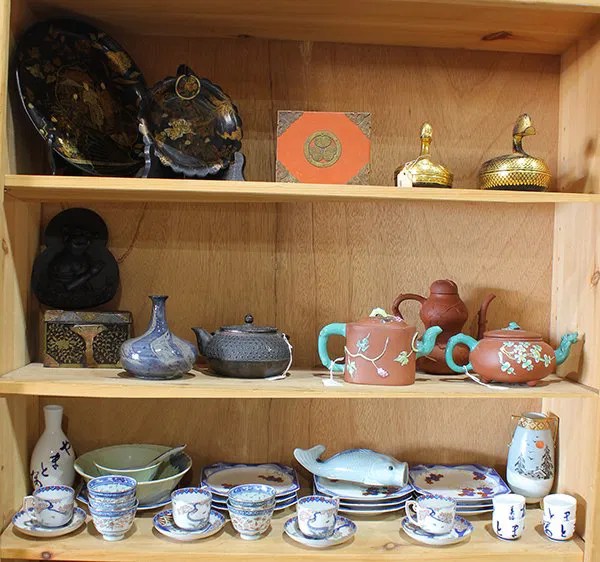 Three Shelves Of Asian Items