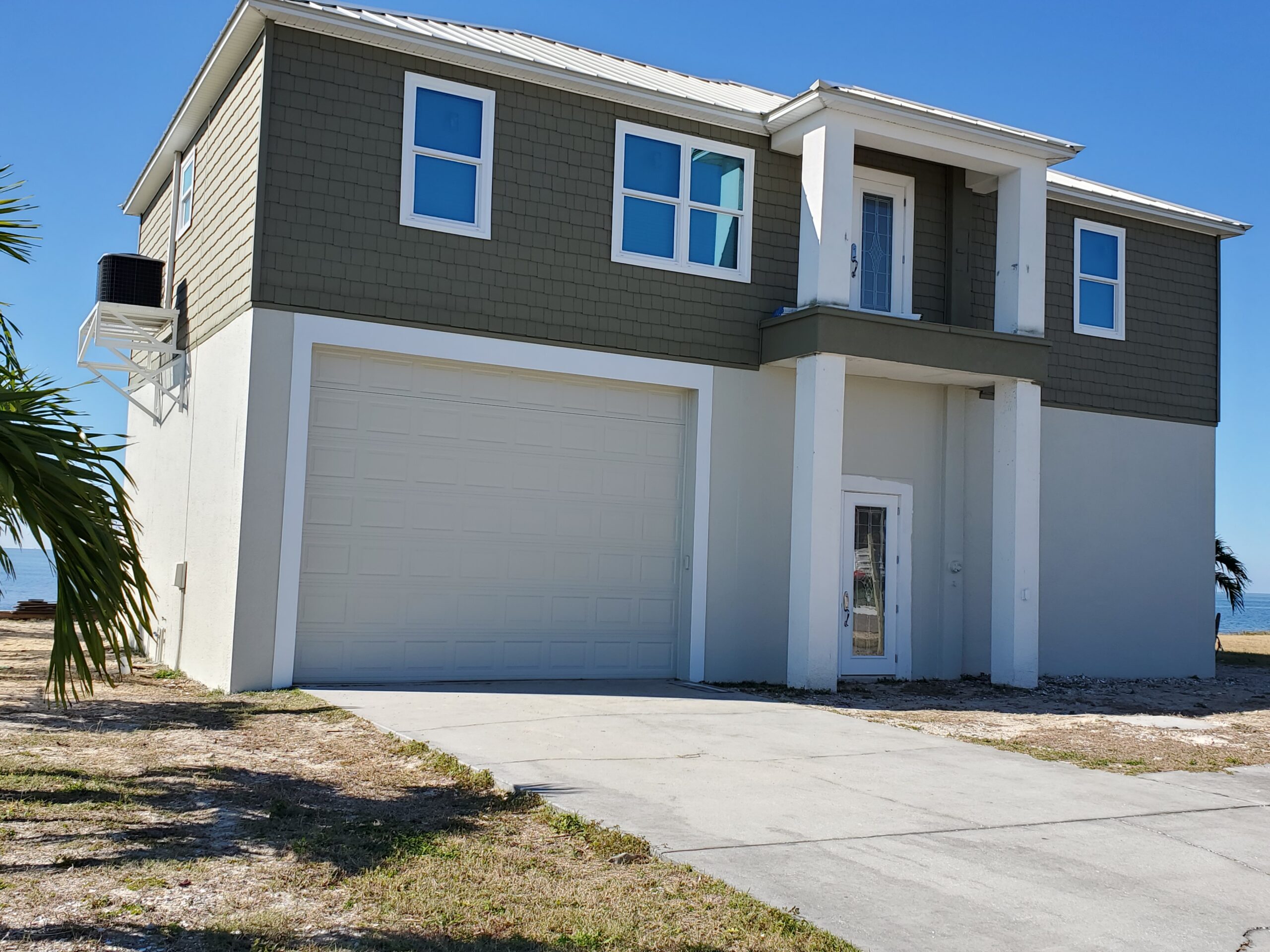 Two Story Residential on the water Orlando Painting Contractor