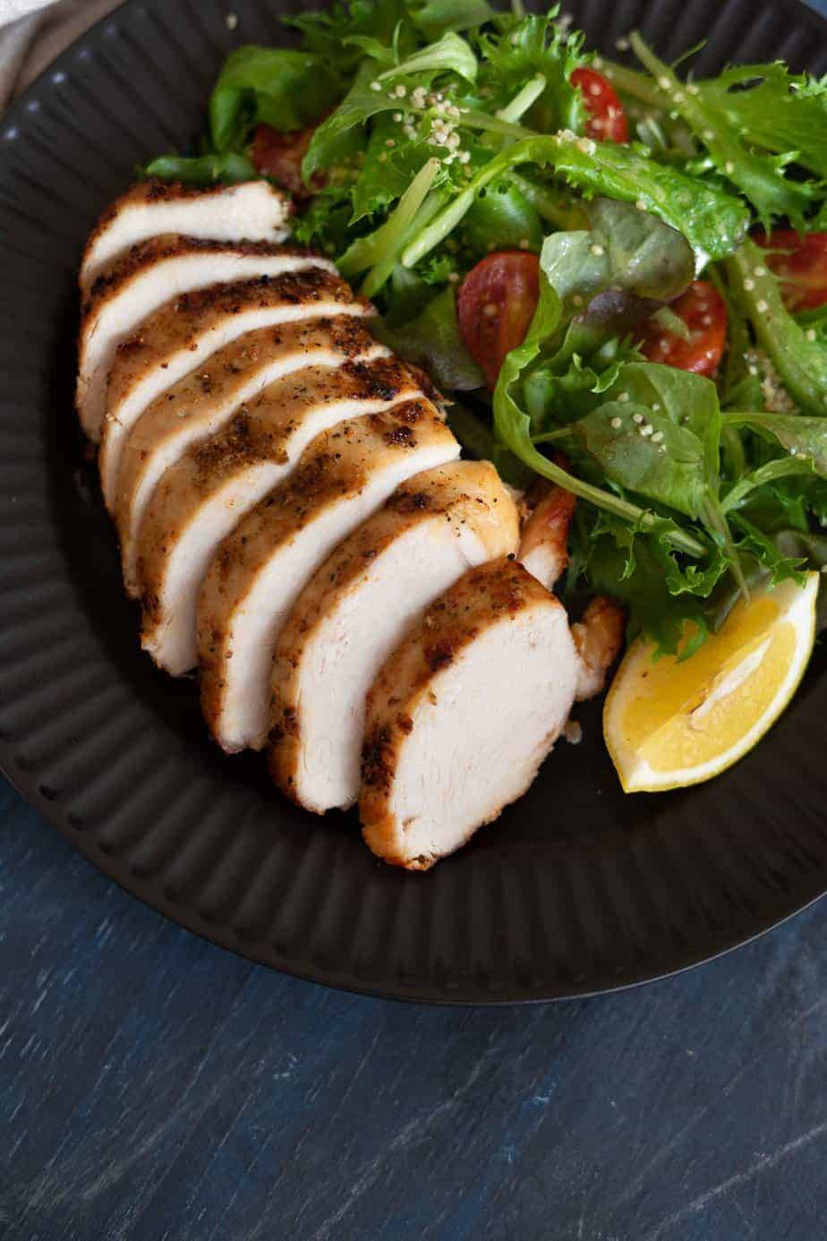 sliced poultry with salad