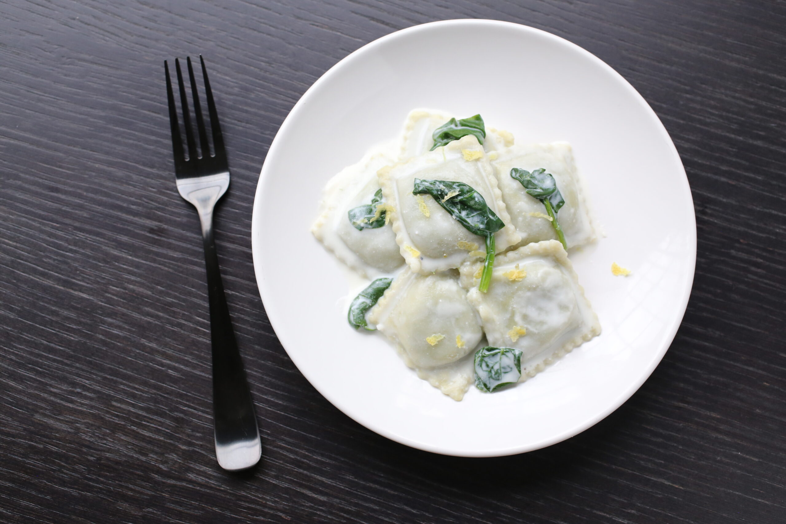 Spinach Ravioli with Lemony Ricotta Sauce and Wilted Spinach Pastosa