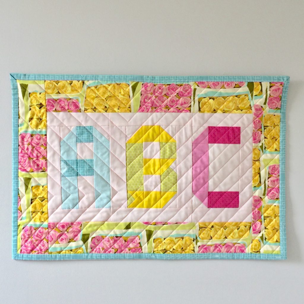 Turn a mini quilt into a wall hanging Patch + Dot