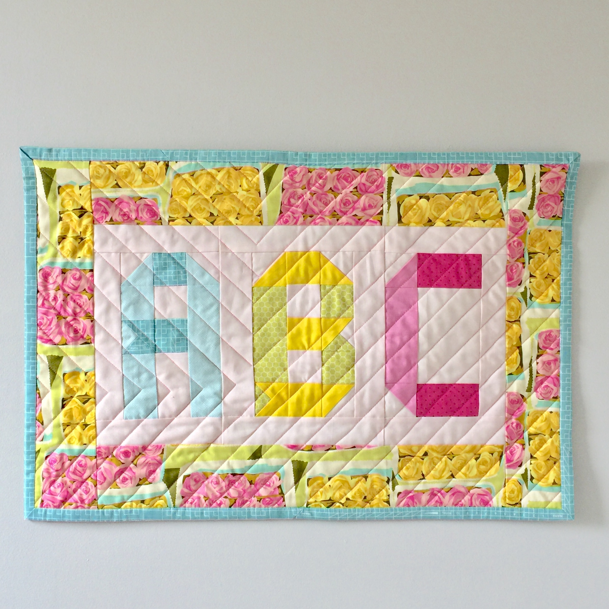 Turn a mini quilt into a wall hanging Patch + Dot