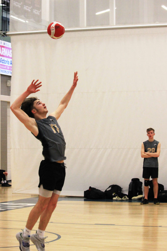 Cedric serving a volleyball