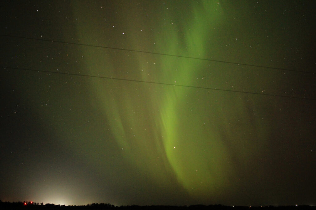 Aurora Borealis swirling over the prairie