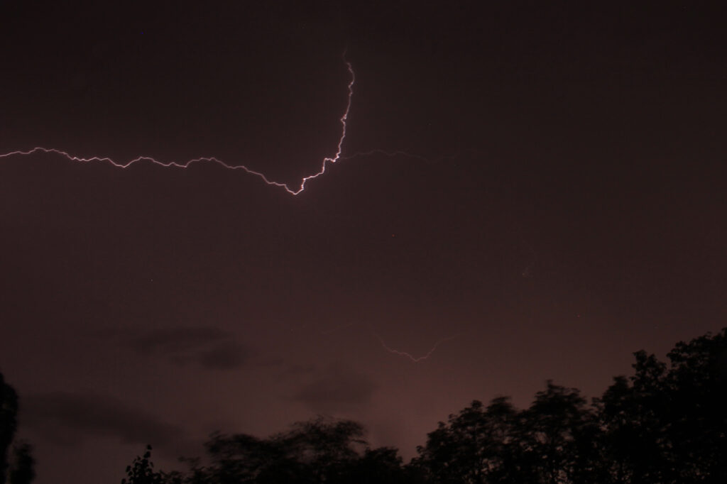 A lightning bolt above the trees