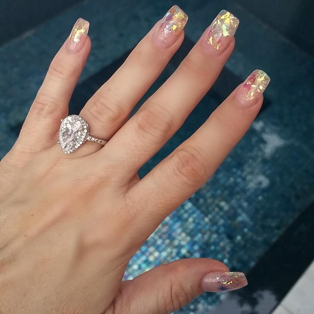 "mother of pearl" nails!! i'm kinda obsessed w/my new nails!they are clear gel w/big rainbow