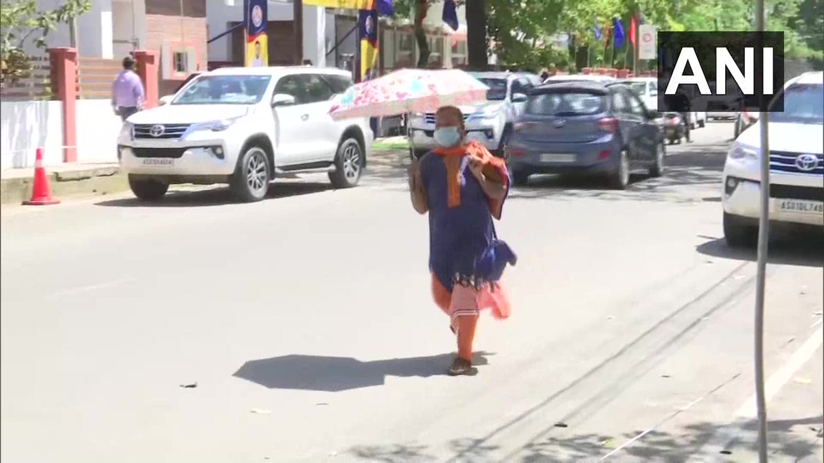 Assam People cover heads hydrate beat heat Guwahati