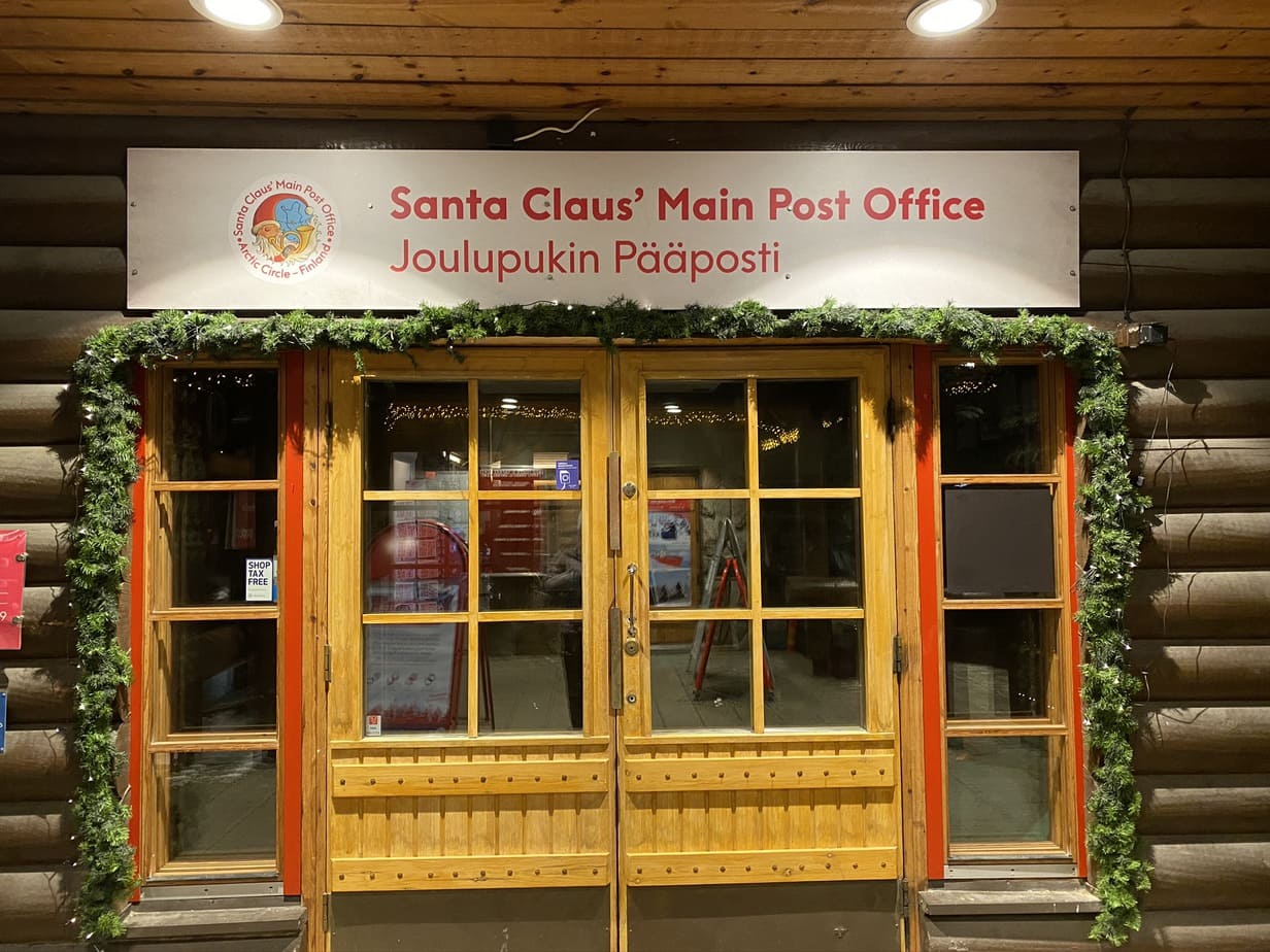 Doors with sign that says "Santa Claus' Main Post Office"