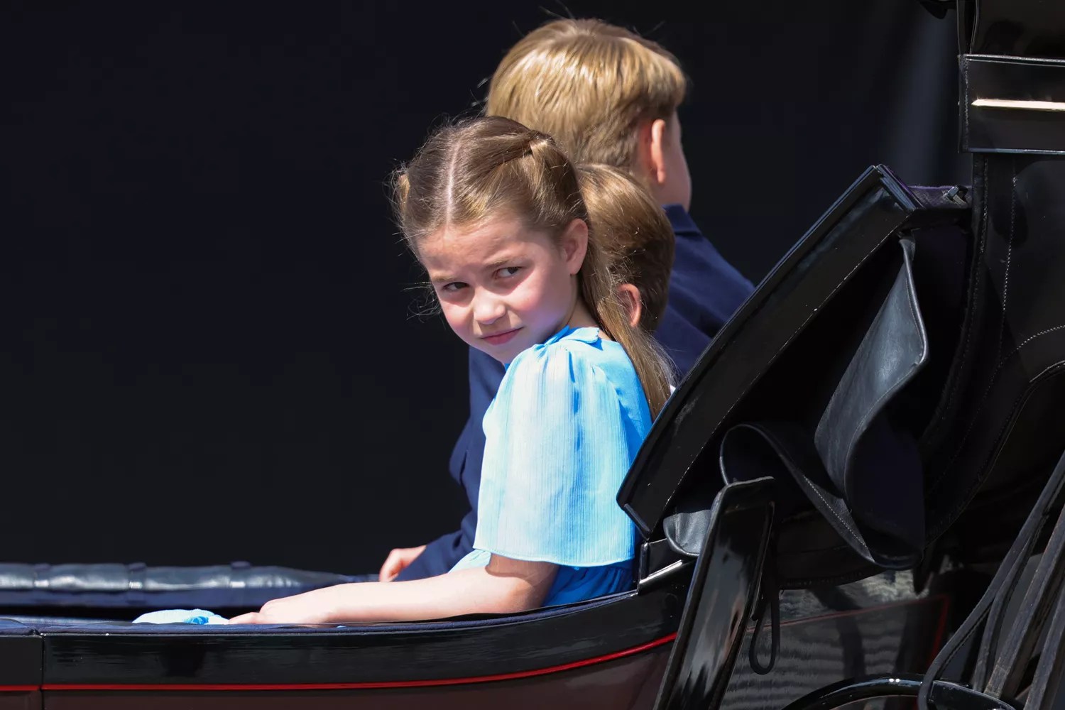 Princess Charlotte of Cambridge rides in a carriage during the Trooping the Colour parade