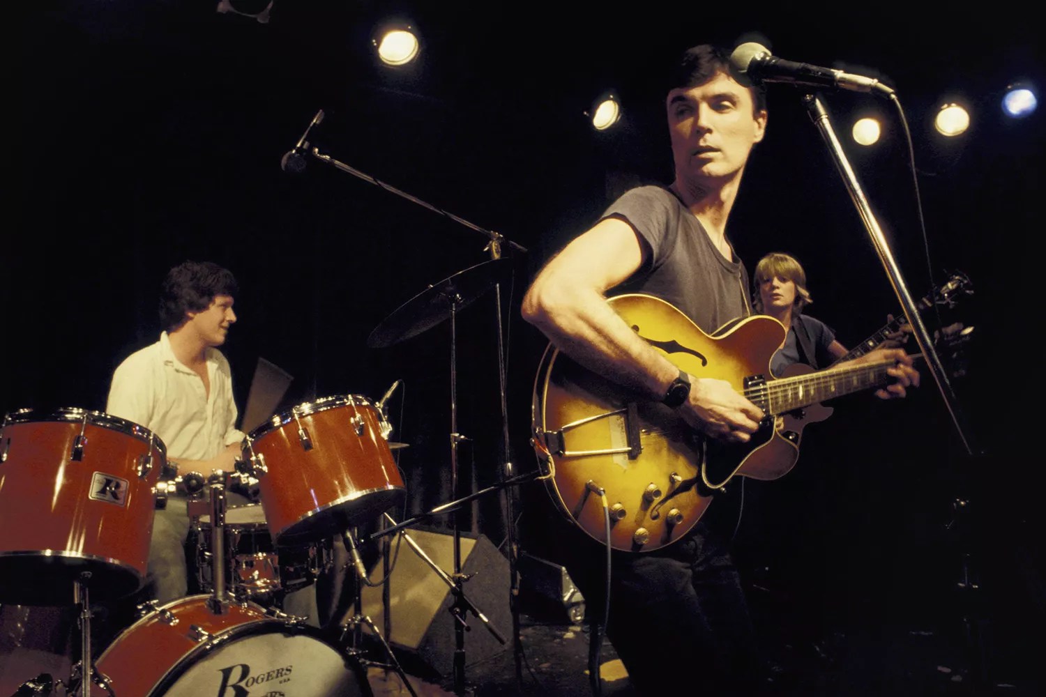 David Byrne and Chris Frantz (drums) and Tina Weymouth (bass) from Talking Heads perform live on stage in New York in 1977