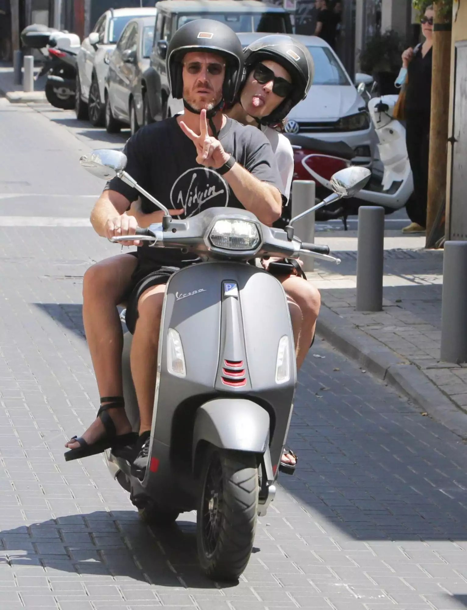 Gal Gadot is spotted riding on the back of a motor scooter with husband, Yaron Varsano in Tel Aviv today.