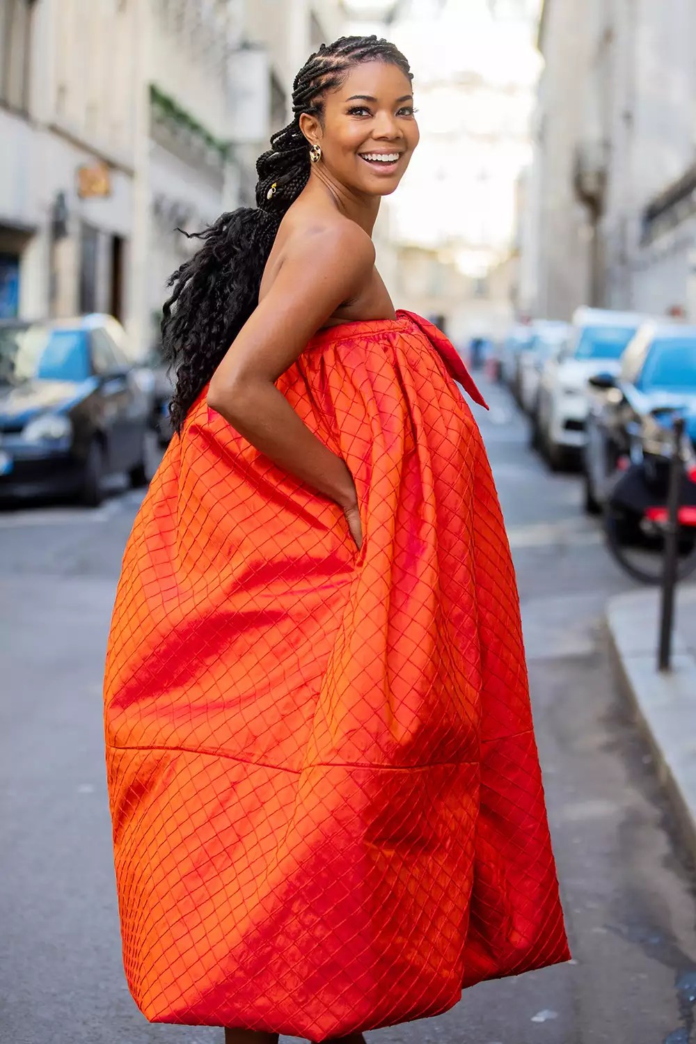 Gabrielle Union is seen wearing orange off shoulder dress Christopher John Rogers and heels during Paris Fashion Week - Menswear F/W 2020-2021 on January 19, 2020 in Paris, France
