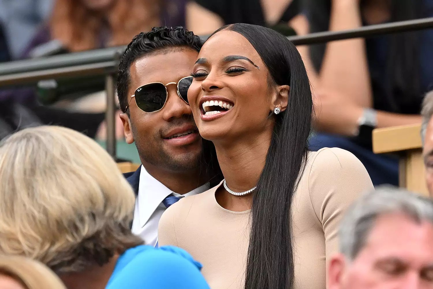 Russell Wilson and Ciara laugh as they attend Day Four of Wimbledon 2022 at the All England Lawn Tennis and Croquet Club on June 30, 2022 in London, England.