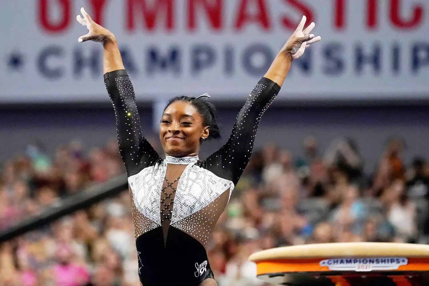 Simone Biles celebrates after competing in the vault during the U.S. Gymnastics Championships, in Fort Worth, Texas