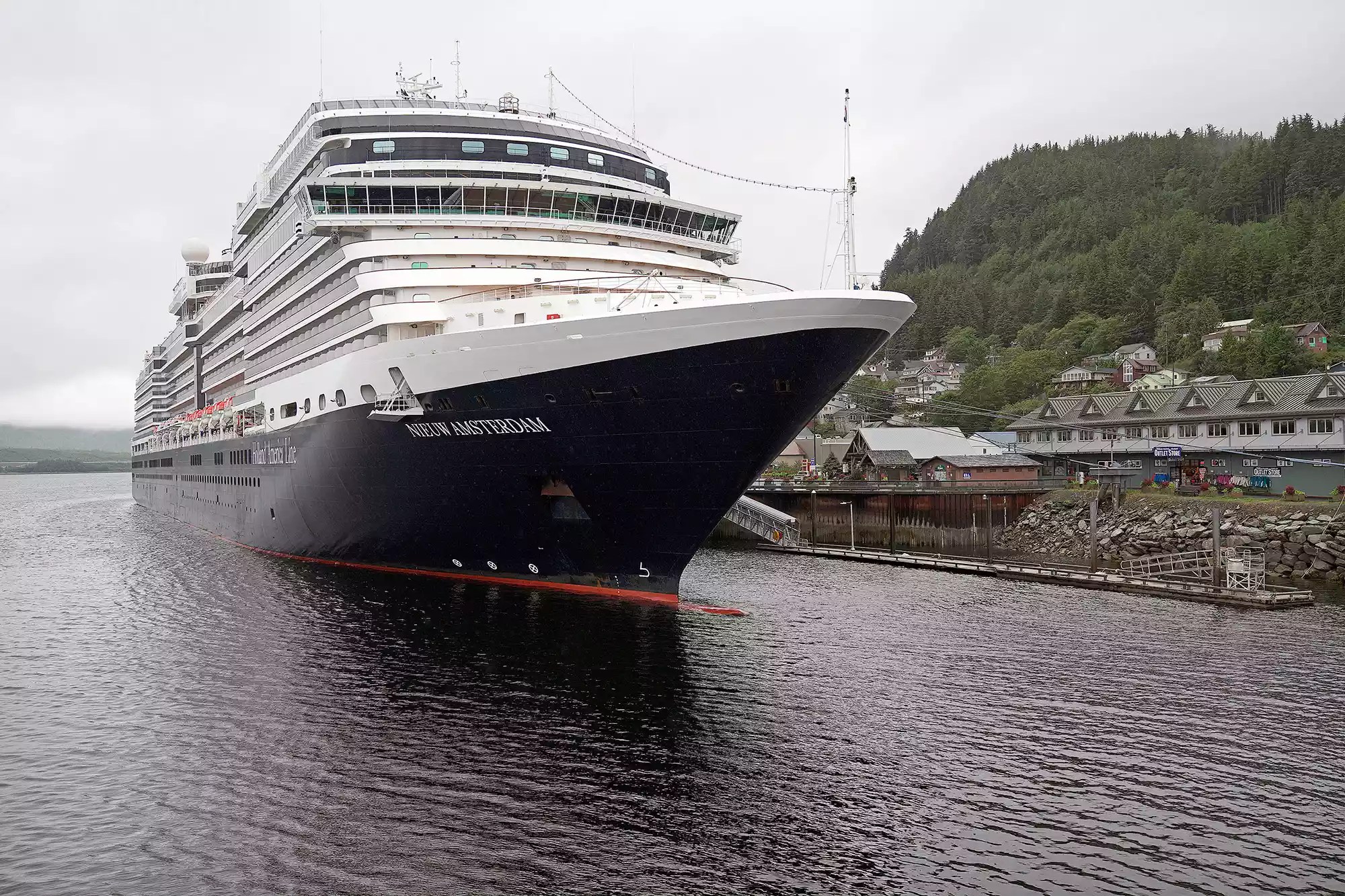 The Holland America Line cruise ship Nieuw Amsterdam is docked on Thursday, Aug. 5, 2021, at Berth 4 in Ketchikan, Alaska. Holland America confirmed Thursday that five passengers from the Nieuw Amsterdam were aboard a float plane that crashed Thursday morning during a tour of the Misty Fjords National Monument.