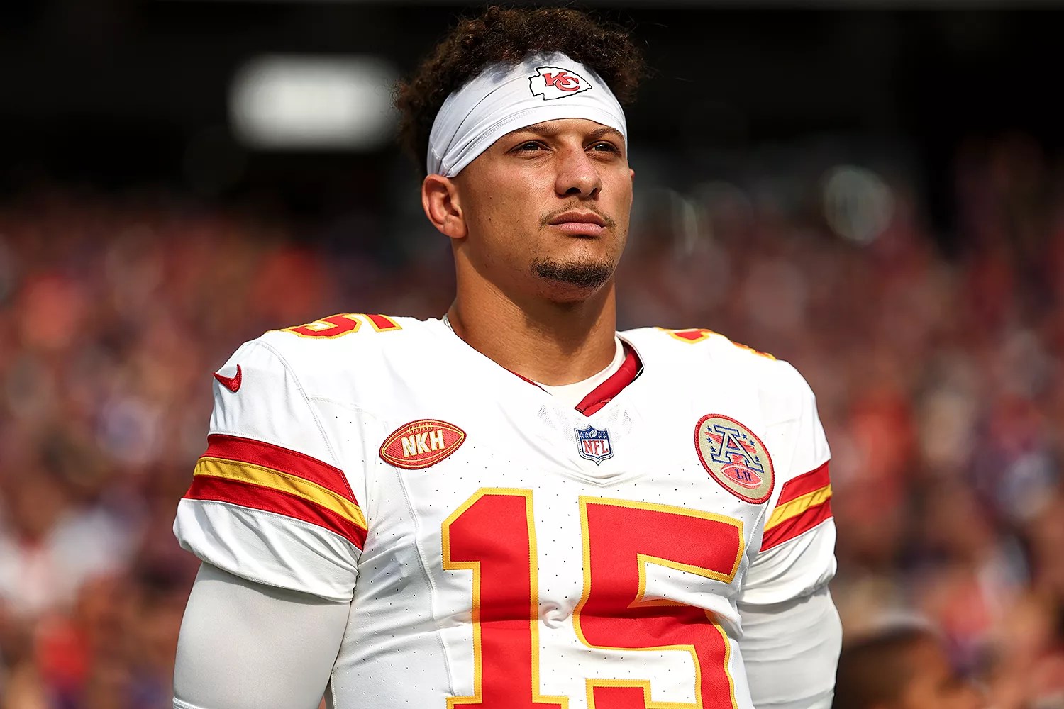 Patrick Mahomes #15 of the Kansas City Chiefs stands on the sidelines during the national anthem prior to an NFL football game against the Minnesota Vikings at U.S. Bank Stadium on October 8, 2023 in Minneapolis, Minnesota.