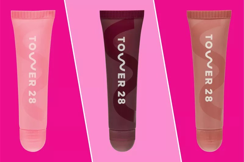 Collage of three Tower 28 Lip Treatment tubes on a pink background