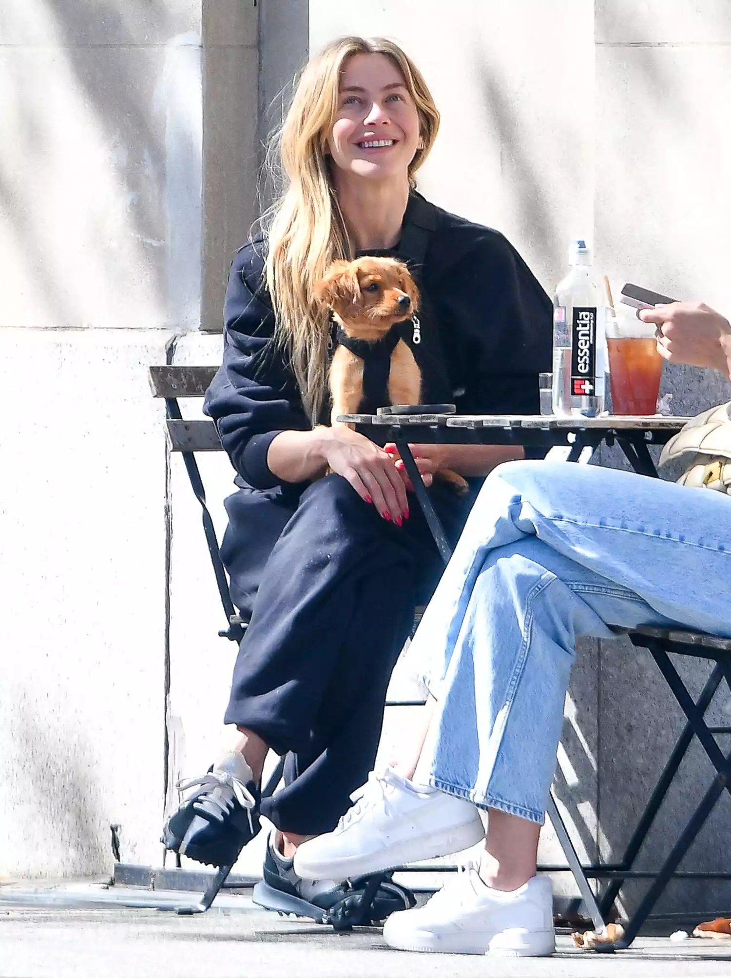 EXCLUSIVE: Julianne Hough gets a kiss from her new puppy in New York City.