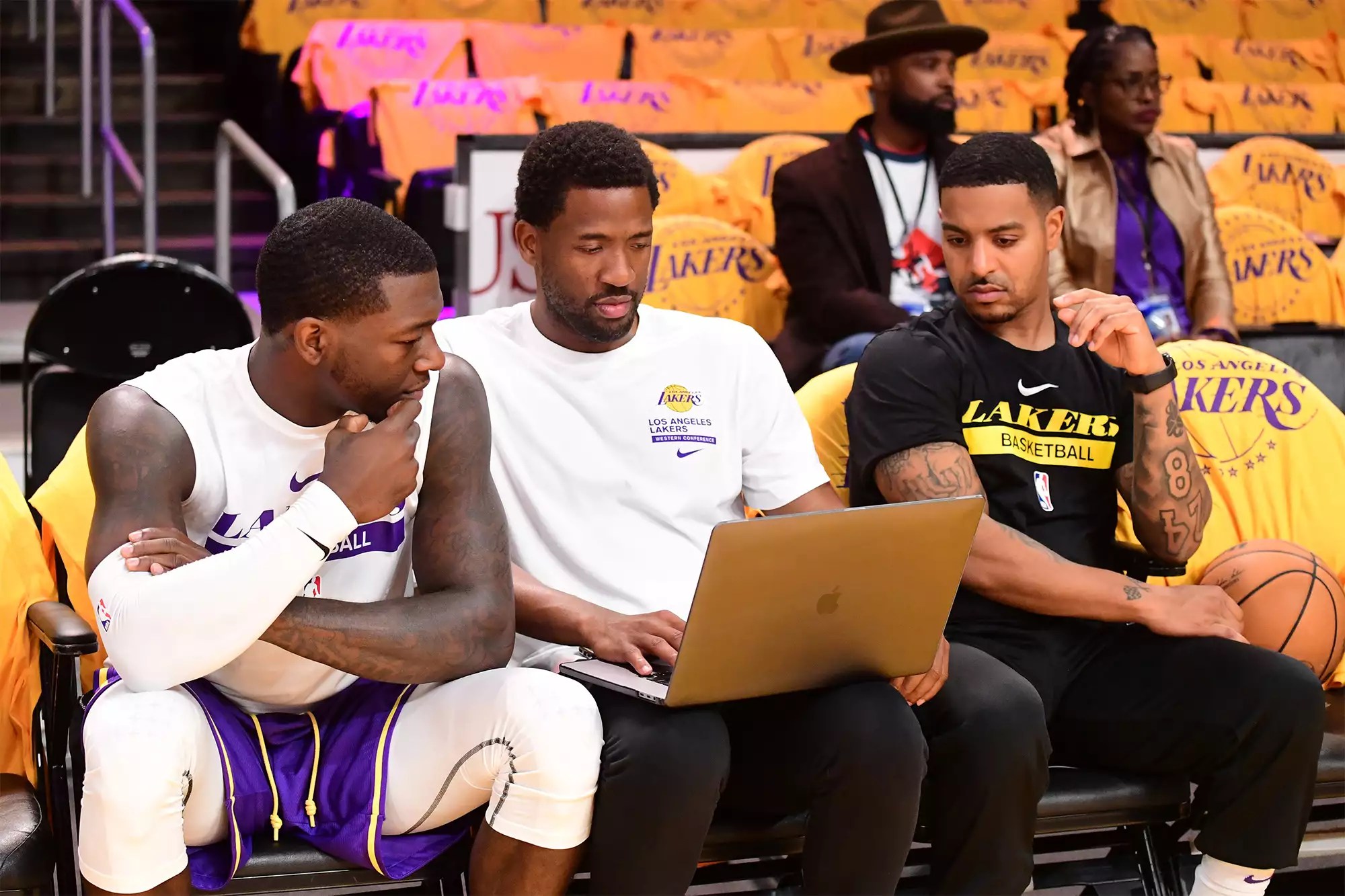 Kendrick Nunn #12 of the Los Angeles Lakers reviews footage with assistant coach J.D. DuBois before the game against the LA Clippers on October 20, 2022 at Crypto.Com Arena in Los Angeles, California.