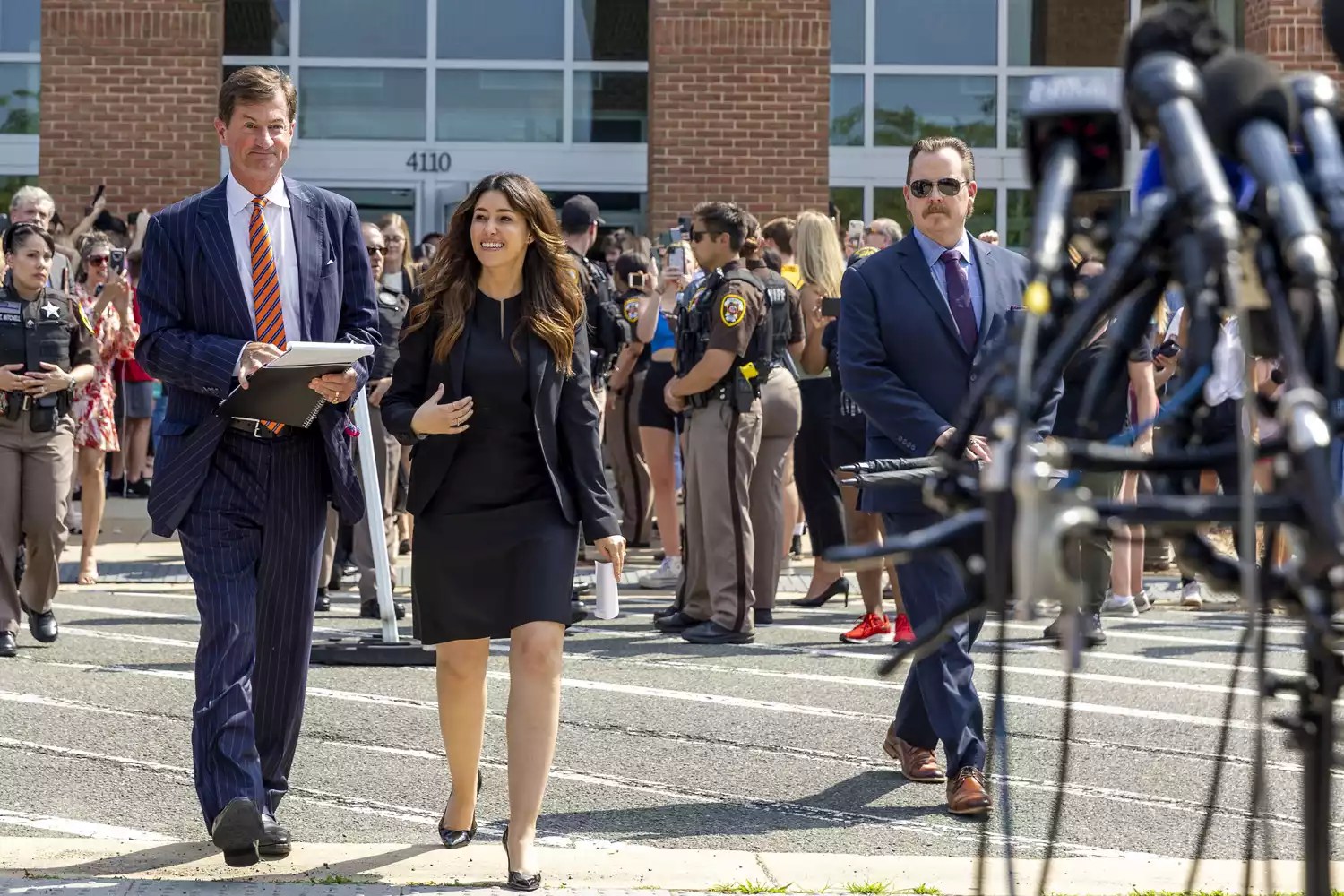 Ben Chew and Camille Vasquez, attorneys for US actor Johnny Depp, arrive to speak to reporters outside the Fairfax County Circuit Courthouse
