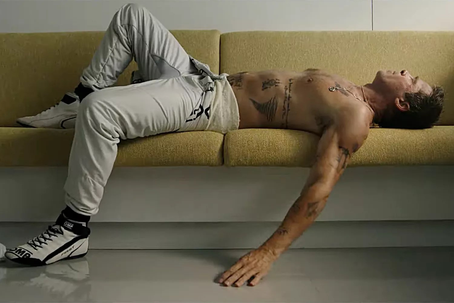 Brad Pitt Gives a Rare Glimpse at His Tattoos in Shirtless Scene of His F1 Movie Trailer
