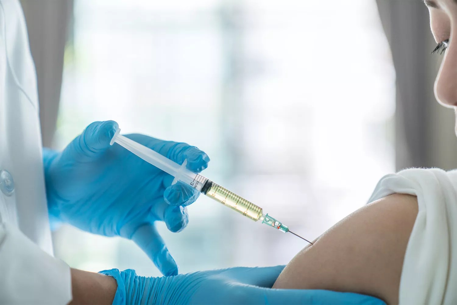 doctor make vaccinating to patient