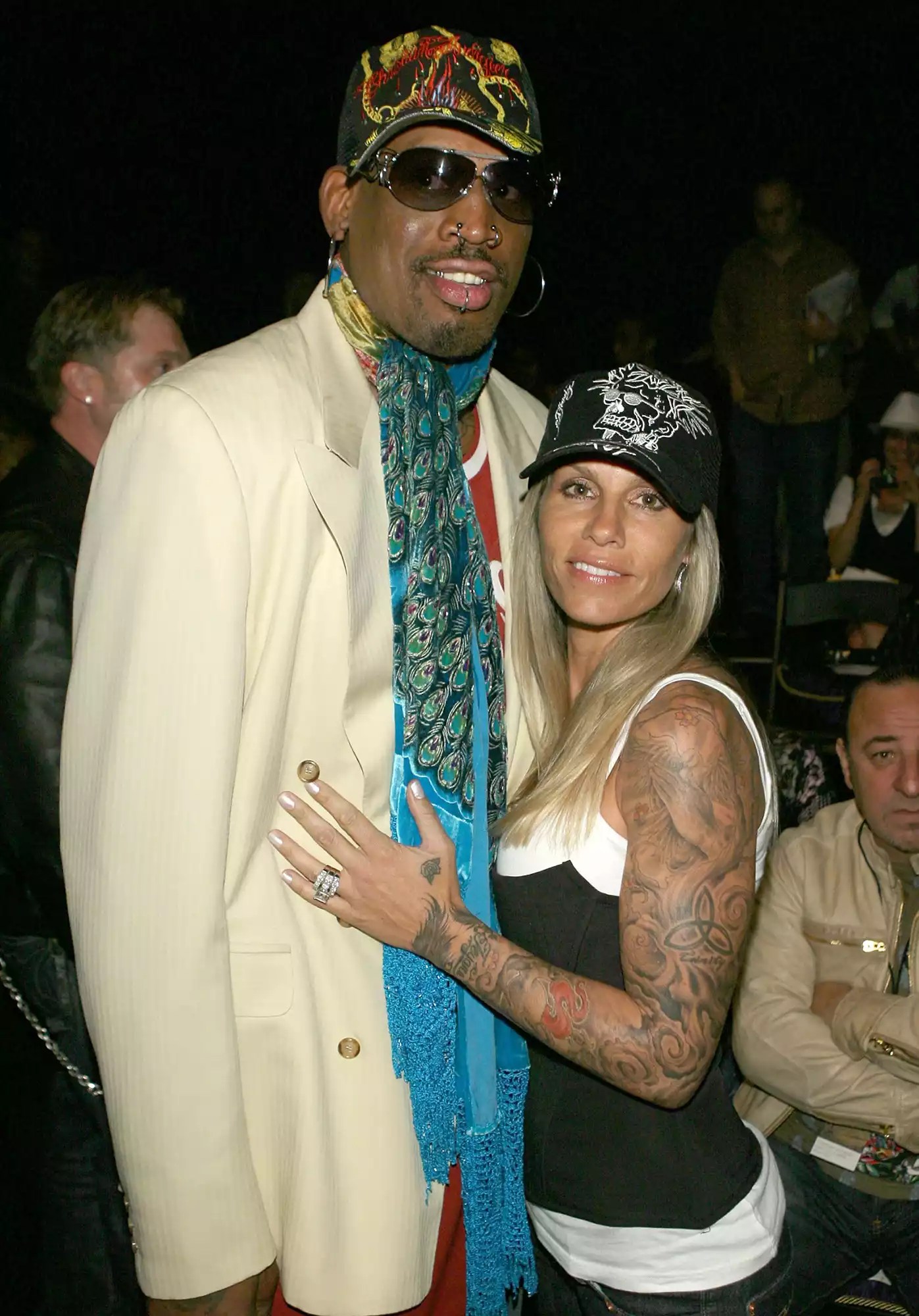 Dennis Rodman (L) and Michelle Moyer pose in the front row at the Christian Audigier Fall 2007 fashion show