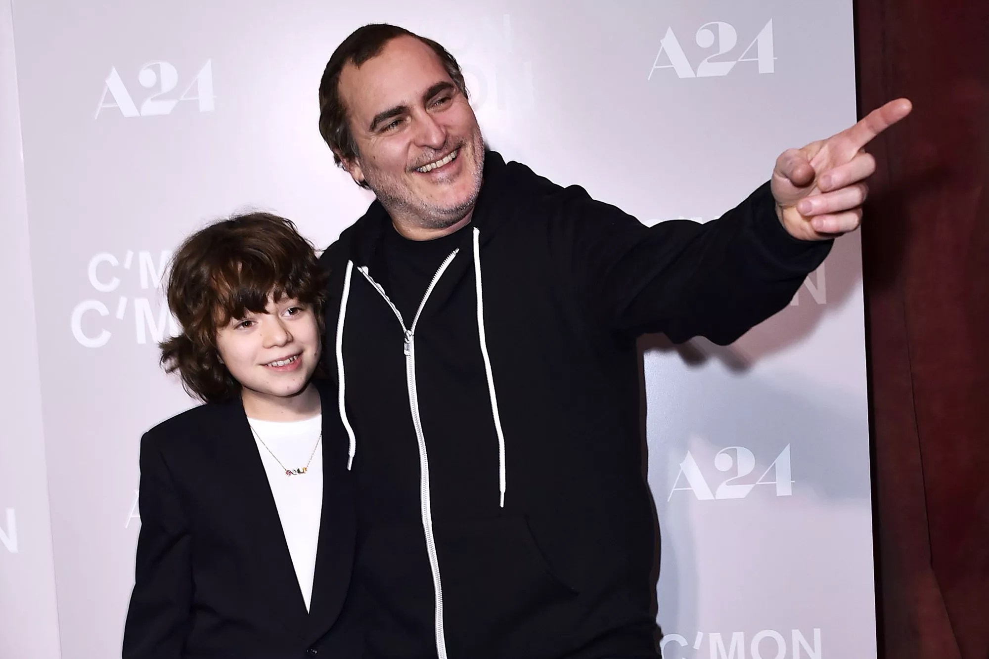 Woody Norman, left, and Joaquin Phoenix arrive at a special screening of &ldquo;C&rsquo;mon C&rsquo;mon&rdquo; at Fine Arts Theater, in Los Angeles LA Special Screening of &ldquo;C&rsquo;mon C&rsquo;mon&rdquo;, Los Angeles, United States - 16 Nov 2021