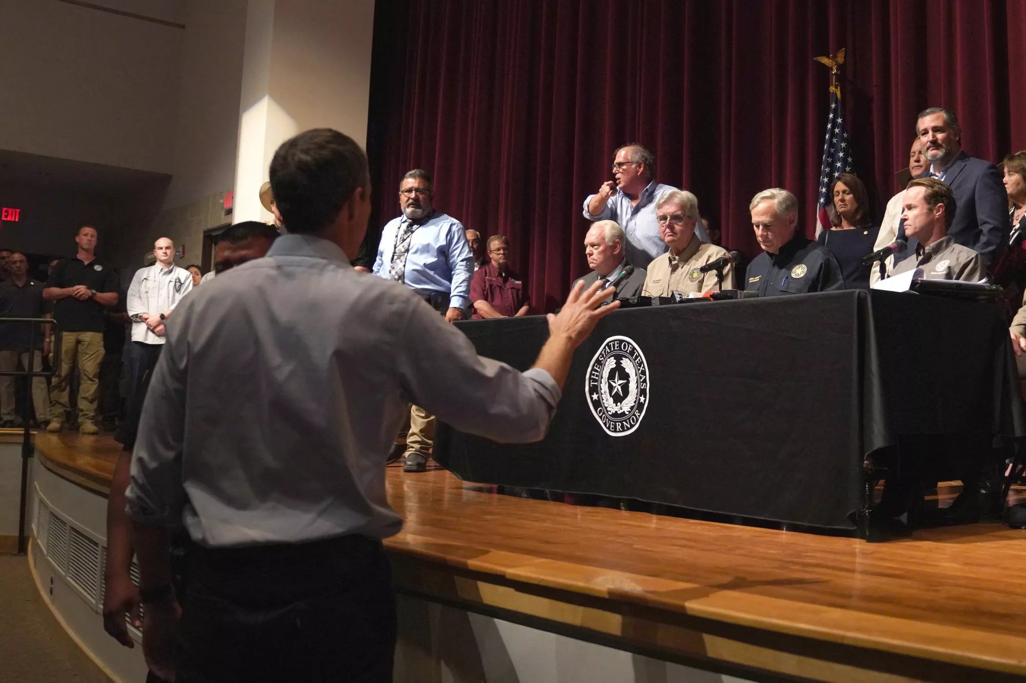 Democratic gubernatorial candidate Beto O&rsquo;Rourke interrupts Texas Governor Greg Abbott during a press conference to provide updates on the Uvalde elementary school shooting, at Uvalde High School in Uvalde, Texas on May 25, 2022. - The tight-knit Latino community of Uvalde was wracked with grief Wednesday after a teen in body armor marched into the school and killed 19 children and two teachers, in the latest spasm of deadly gun violence in the US. (Photo by allison dinner / AFP) (Photo by ALLISON DINNER/AFP via Getty Images)