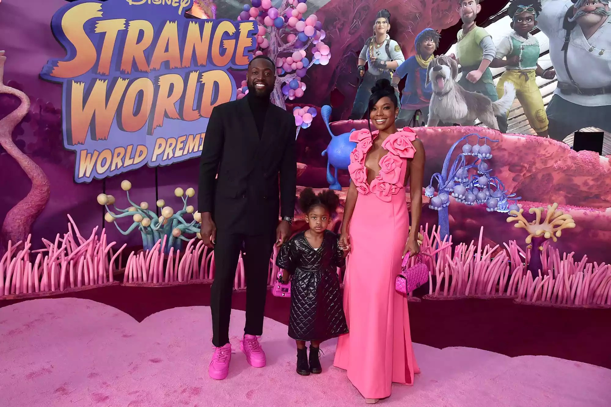 LOS ANGELES, CALIFORNIA - NOVEMBER 15: (L-R) Dwyane Wade, Kaavia James Union Wade, and Gabrielle Union attend the world premiere of Walt Disney Animation Studios' Strange World at El Capitan Theatre in Hollywood, California on November 15, 2022. (Photo by Alberto E. Rodriguez/Getty Images for Disney)