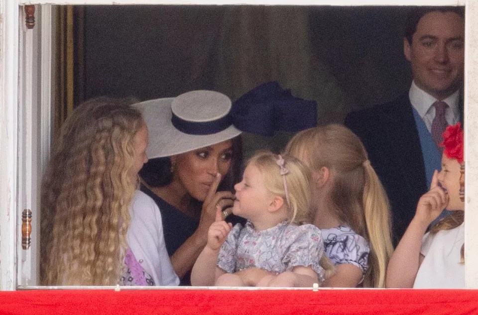 Meghan Markle with Savannah Phillips and Mia Tindall in the Major General&rsquo;s office overlooking The Trooping of the Colour on Horse Guards Parade.