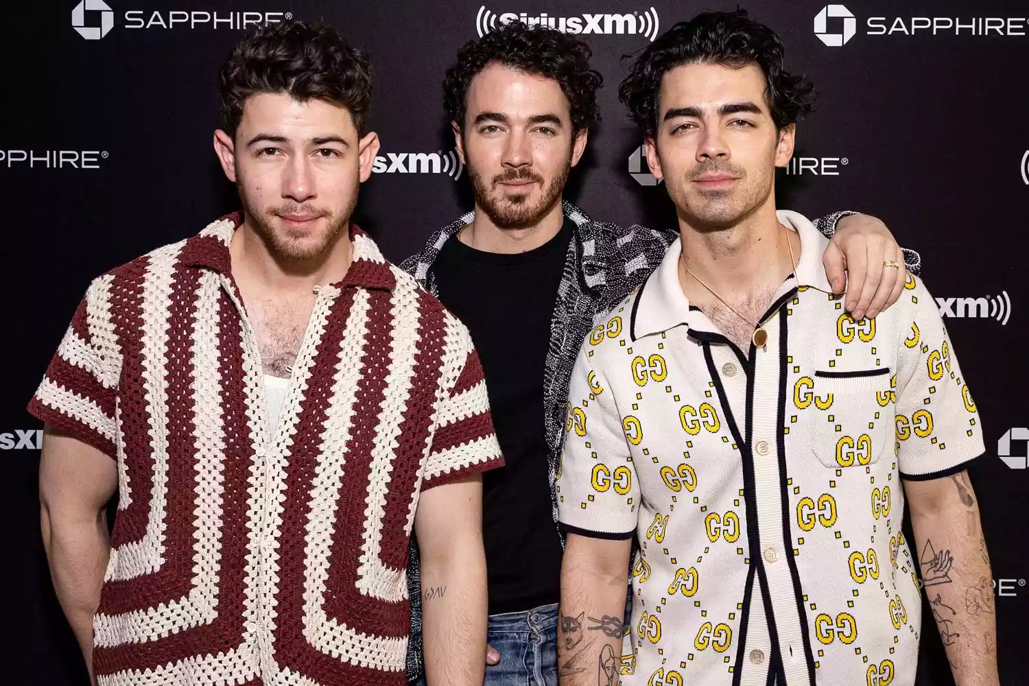 Nick Jonas, Kevin Jonas and Joe Jonas of the Jonas Brothers pose at the SiriusXM Miami Studios