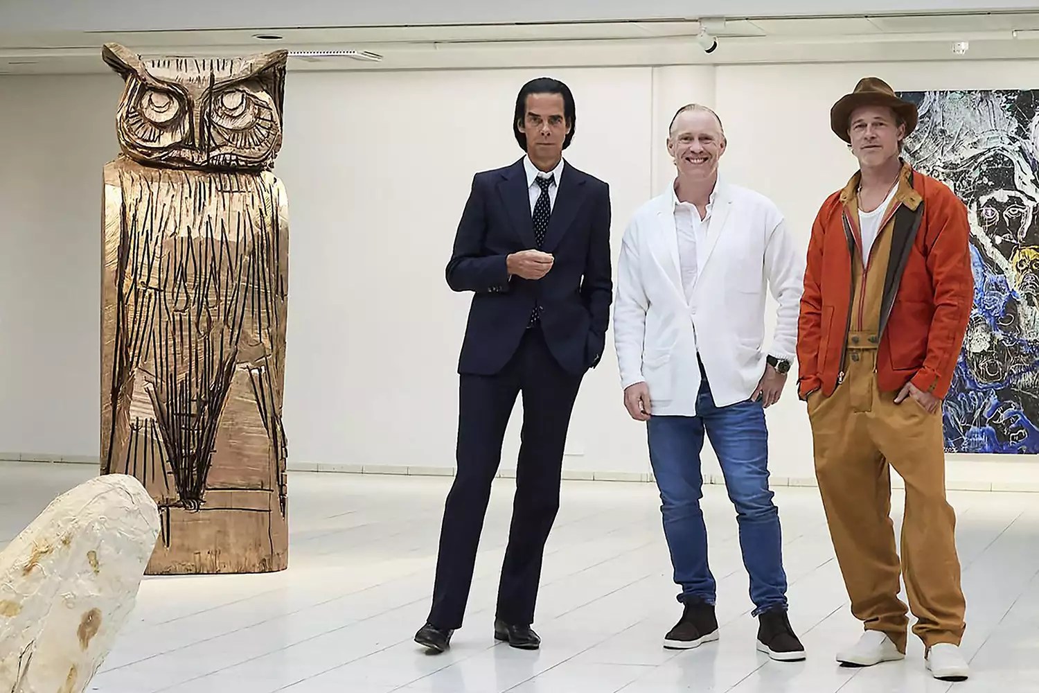 This handout photo taken on September 17, 2022 and received on September 19, 2022 shows British artist Thomas Houseago (C) posing with US actor Brad Pitt (R) and Australian musician Nick Cave prior to the opening of the exhibition &lsquo;Thomas Houseago - WE with Nick Cave and Brad Bitt&rsquo; at The Sara Hilden Art Museum in Tampere, Finland.