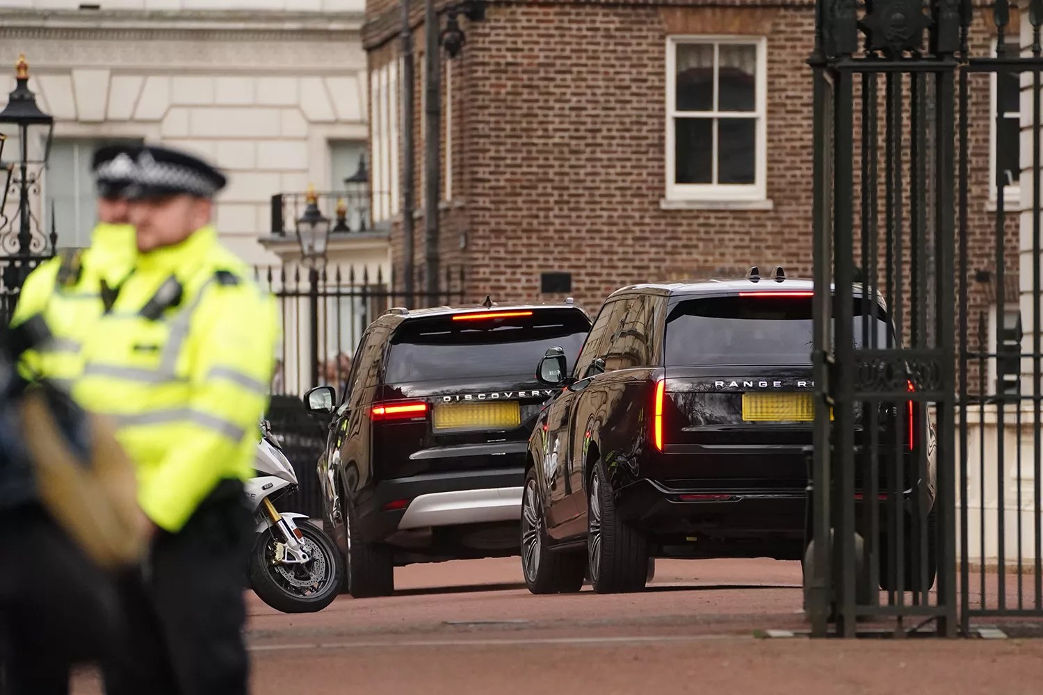 Two black SUVs, believed to be carrying Prince Harry, arrive at Clarence House,