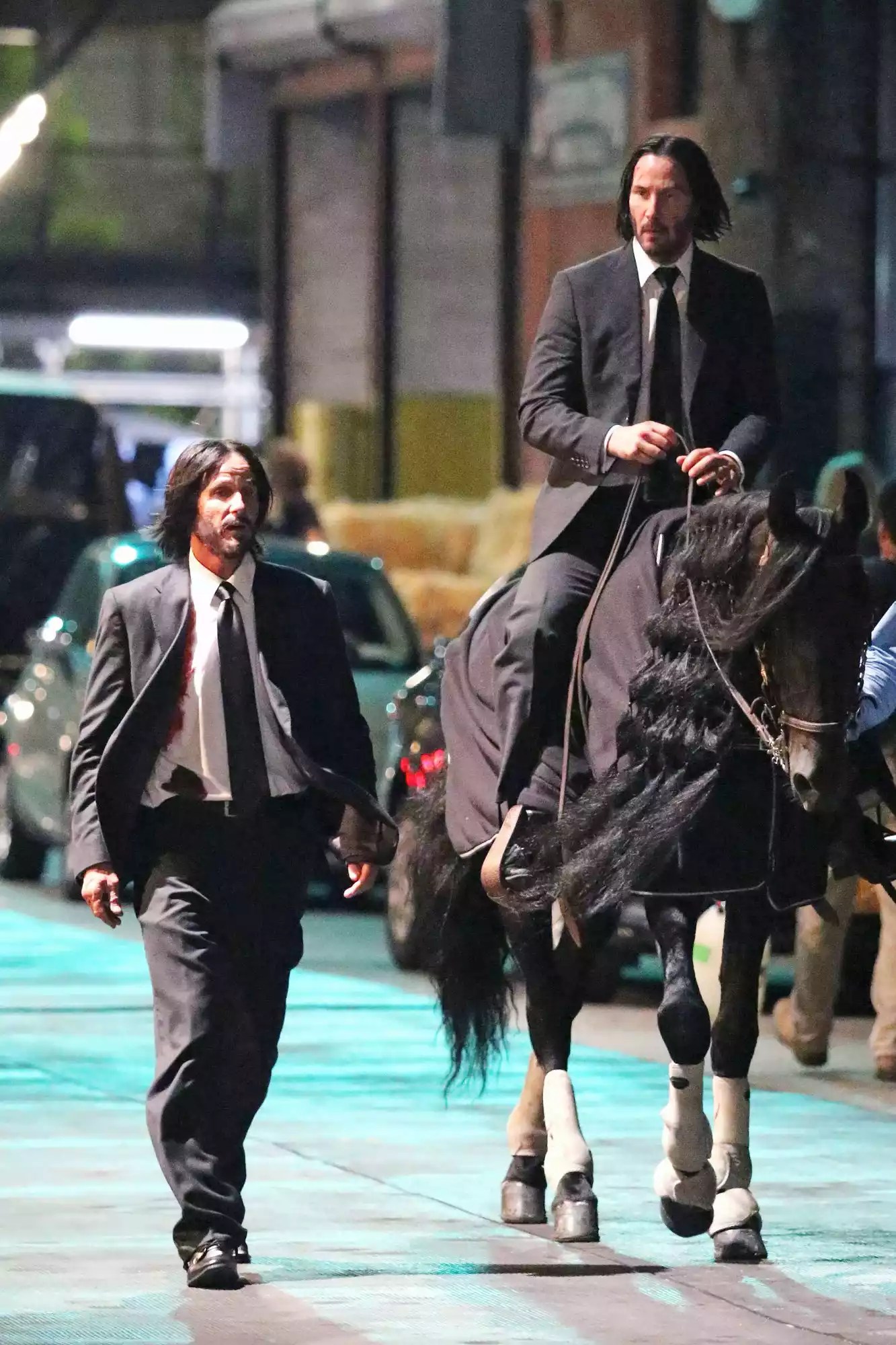 Keanu Reeves gets hit by car and falls to the ground in pain and escapes on horseback for JOHN WICK 3 in NYC.