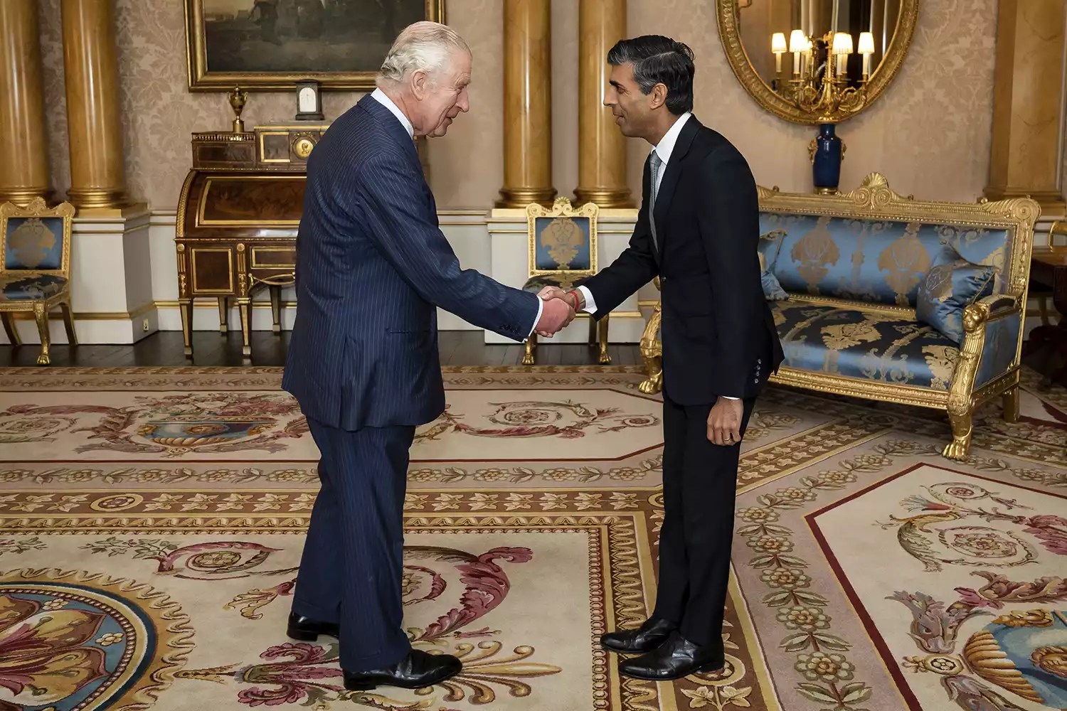 King Charles III welcomes Rishi Sunak during an audience at Buckingham Palace
