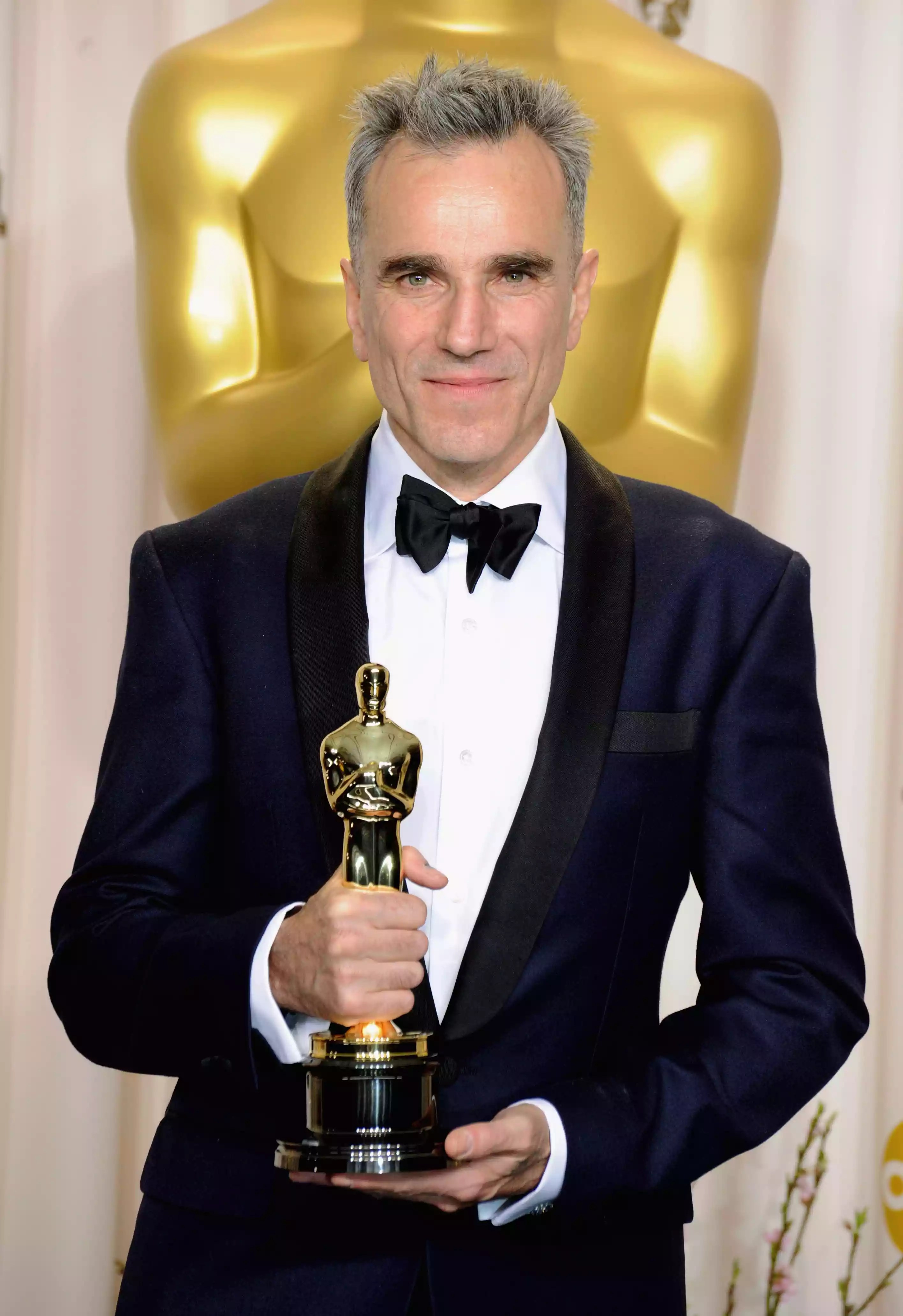 Daniel Day-Lewis poses with his Oscar in the press room at Loews Hollywood Hotel on Feb. 24, 2013.