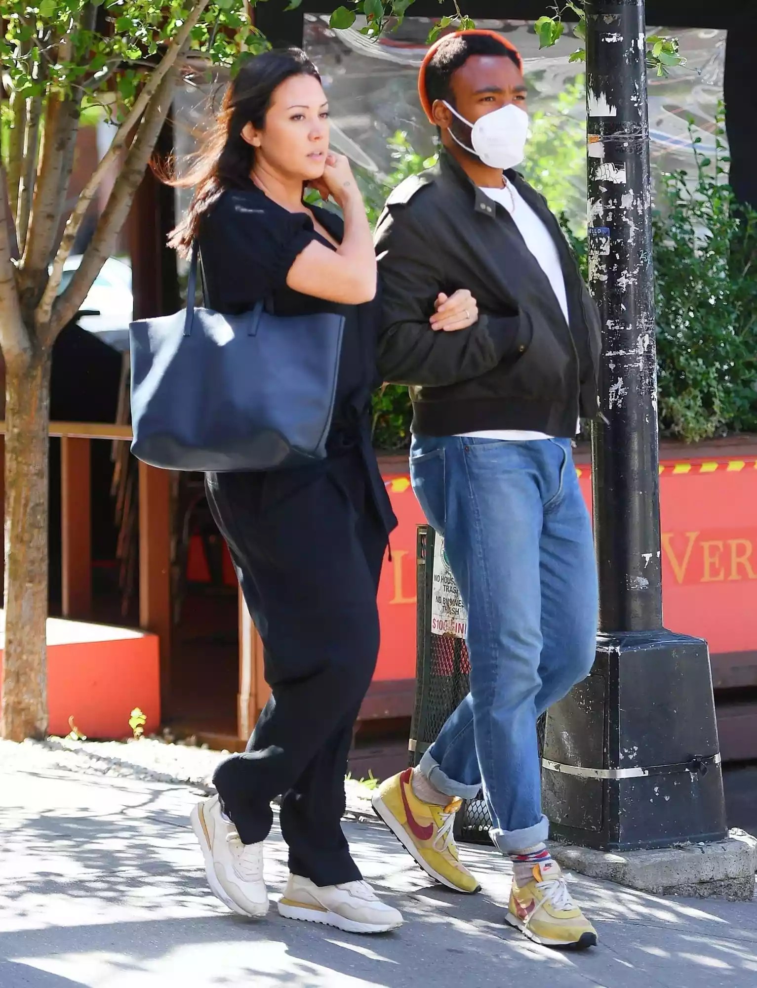 Rapper/actor/comedian Donald Glover takes a stroll through Tribeca alongside his partner, Michelle White.