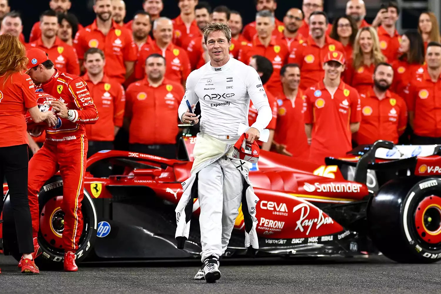 Brad Pitt, star of the upcoming Formula One based movie, F1, walks from the Ferrari team photo during previews ahead of the F1 Grand Prix of Abu Dhabi at Yas Marina Circuit on December 05, 2024 in Abu Dhabi, United Arab Emirates.