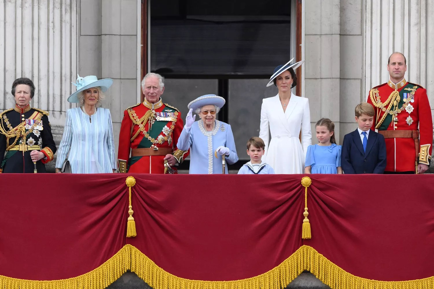 Britain&rsquo;s Queen Elizabeth II (C) stands with from left, Britain&rsquo;s Princess Anne, Princess Royal, Britain&rsquo;s Camilla, Duchess of Cornwall, Britain&rsquo;s Prince Charles, Prince of Wales, Britain&rsquo;s Prince Louis of Cambridge, Britain&rsquo;s Catherine, Duchess of Cambridge, Britain&rsquo;s Princess Charlotte of Cambridge , Britain&rsquo;s Prince George of Cambridge, Britain&rsquo;s Prince William, Duke of Cambridge , to watch a special flypast from Buckingham Palace