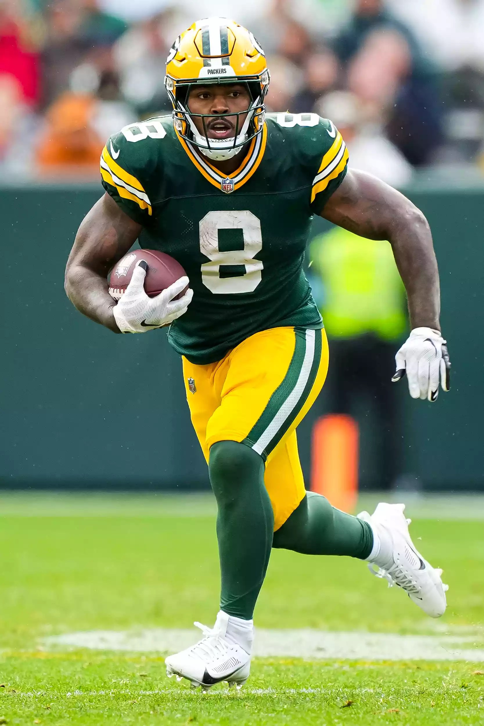 Running back Josh Jacobs #8 of the Green Bay Packers carries the ball during the third quarter of an NFL football game against the Arizona Cardinals