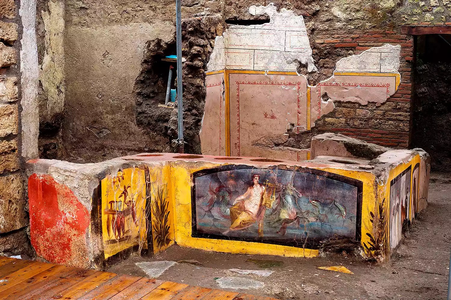 This picture released on December 26, 2020 by the Pompei Press Office shows a thermopolium, a sort of street &ldquo;fast-food&rdquo; counter in ancient Rome, that has been unearthed in Pompei, decorated with polychrome motifs and in an exceptional state of preservation