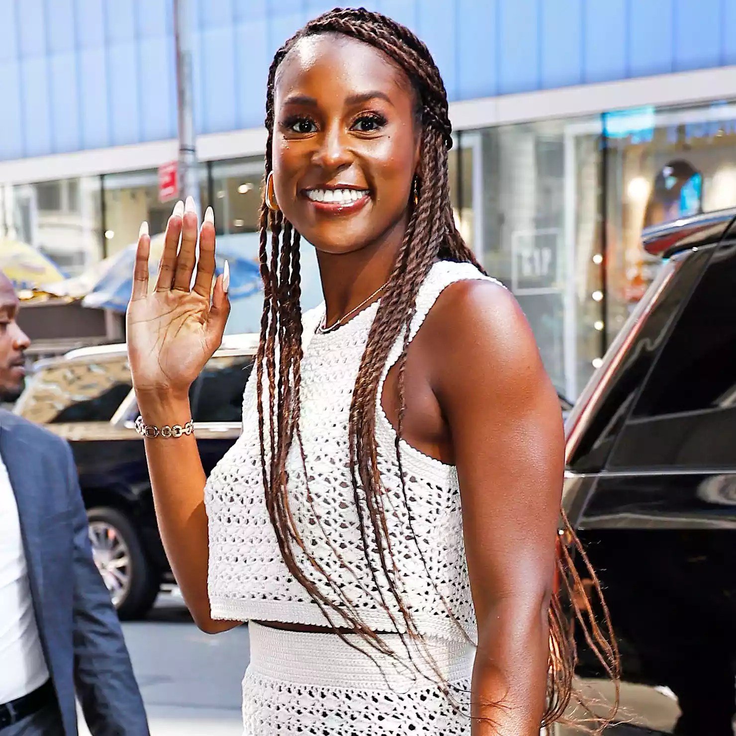 Issa Rae seen wearing a white mesh mini dress paired with Gucci bag and high heels while arriving at Good Morning America show in New York City