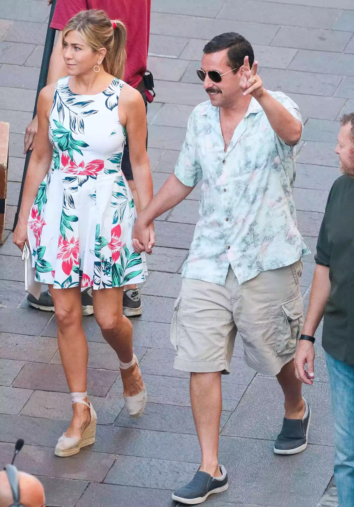 Jennifer Aniston and Adam Sandler are seen on the set of Murder Mystery in Milan, Italy.