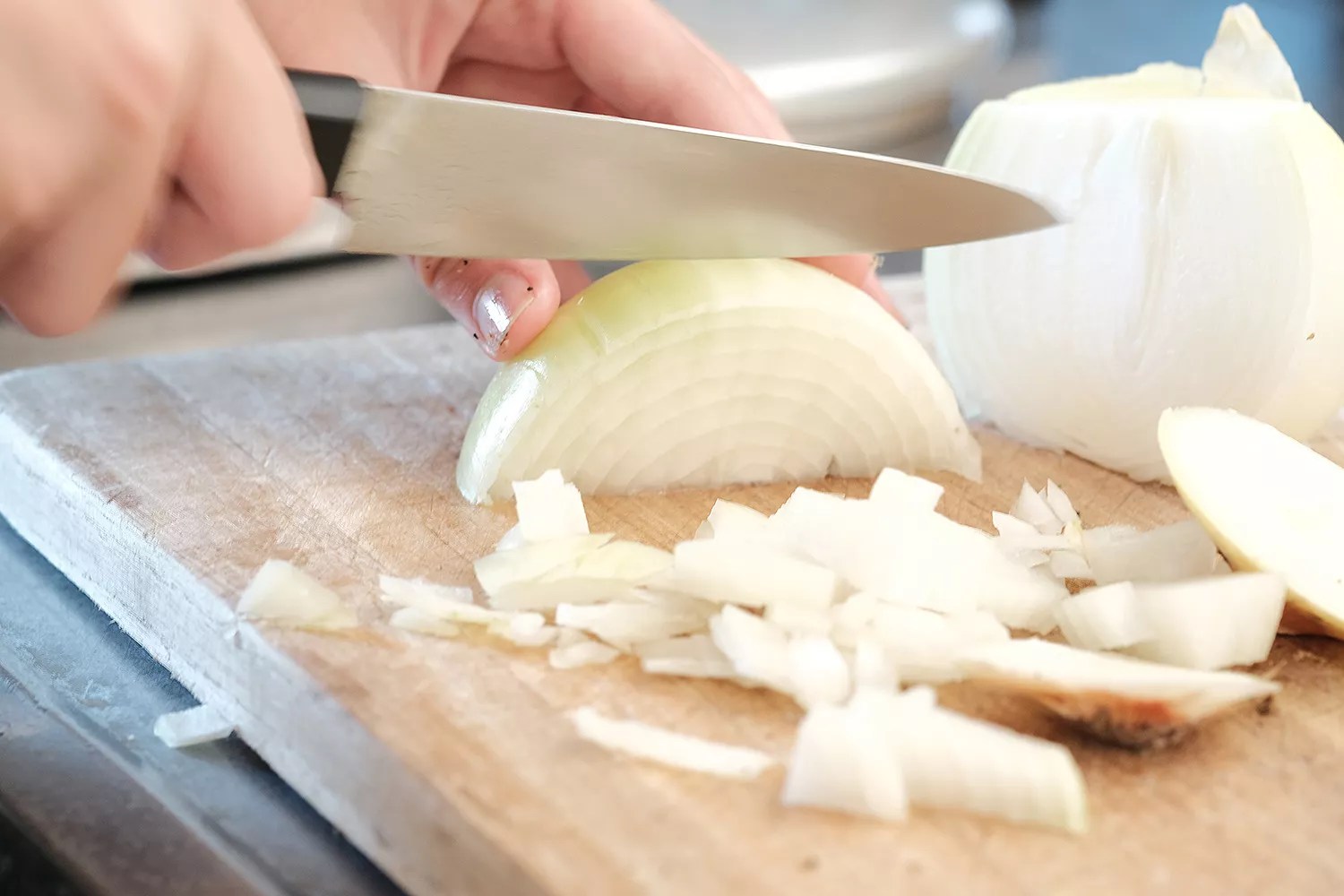 person cutting onions