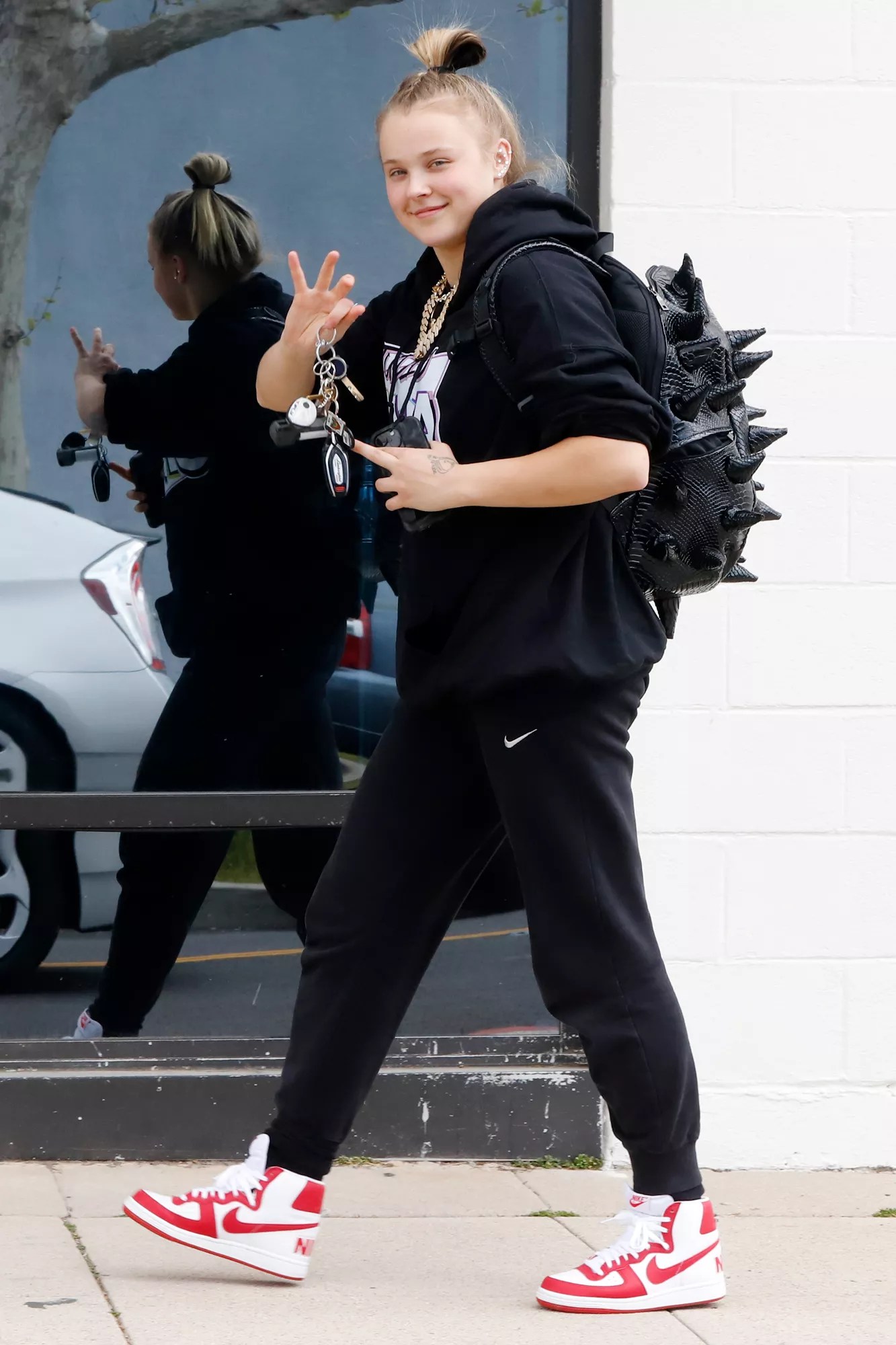 Jojo Siwa is seen arriving at the Studio Siwa for a dance practice in Los Angeles. The sighting comes days after releasing her new single that hit the Billboard chart. JoJo exited her personalized car wearing a black hoodie, matching joggers, and Nike basketball high tops.