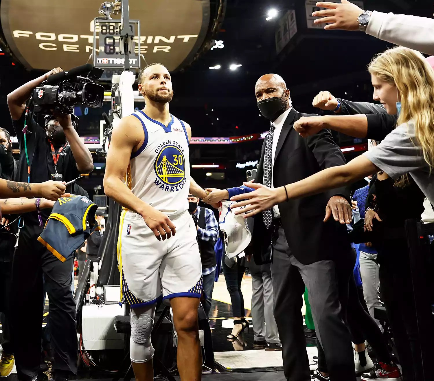 Stephen Curry #30 of the Golden State Warriors walks off the court after defeating the Phoenix Suns in the NBA game at Footprint Center on December 25, 2021 in Phoenix, Arizona.